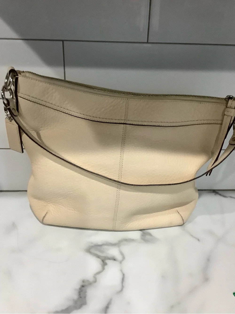 COACH Women's cream colored purse. Crossbody strap also.